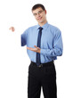 © tonic - Young businessman holding blank board, isolated on white backgro