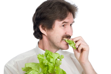 Man eats sheet of the salad