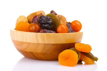 Wall Mural - Dried fruits in wooden bowl isolated on white
