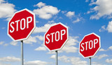 Fototapeta  - Stop signs - against the sky