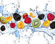Leinwandbild Motiv Fresh fruits in water splash, isolated on white background