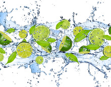 Fresh Limes In Water Splash,isolated On White Background
