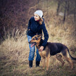 © lightpoet - Master and her obedient (German shepherd) dog