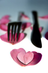 Wall Mural - knife and fork with heart shaped rose petals