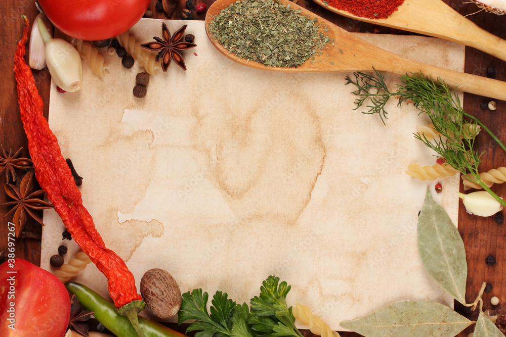 old paper for recipes and spices on wooden table