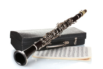 Sticker - Antique clarinet, case and notebook with notes isolated on white