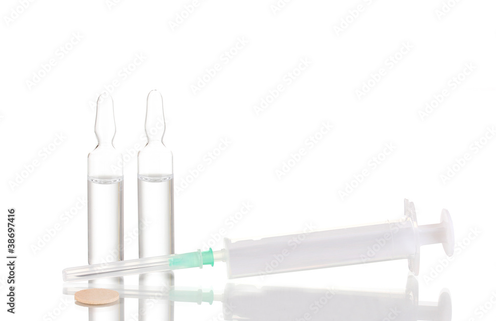 Syringe and medical ampoules isolated on white