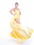 Fototapeta  - Beautiful dancer wearing yellow dress isolated on white