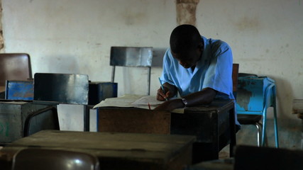 Wall Mural - Students taking an exam in class in a school in a village in Kenya.