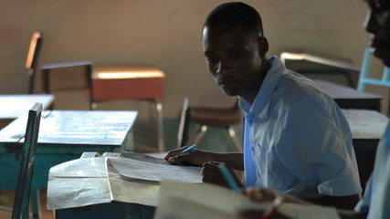 Wall Mural - Classroom taking a test in a school in a village in Kenya.