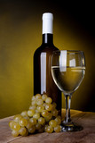 Fototapeta Panele - A glass full of wine and bottle