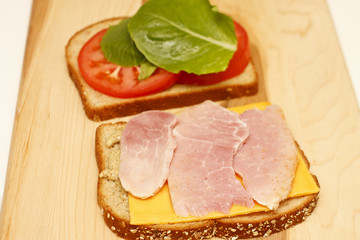 Wall Mural - Ham and Cheese Sandwich with Tomato and Lettuce