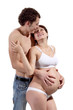 © Aptyp_koK - Young man with his pregnant wife on the white background