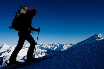 Poster - Silhouette of ski mountaineer in winter Alps