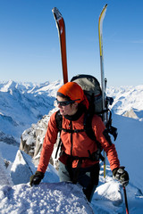 Canvas Print - Young woman doing ski touring. Outdoor winter activity