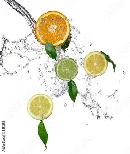 Fototapeta na wymiar Fresh limes and lemons with water splash