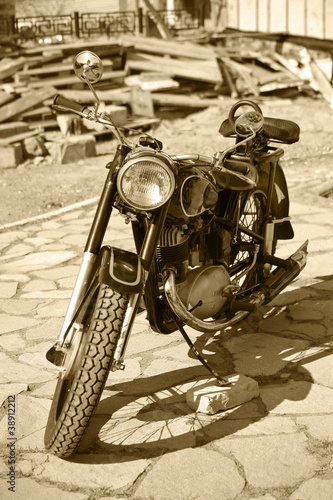 Fototapeta na wymiar Retro motorcycle in court yard