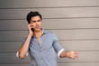 handsome, young businessman on phone
