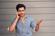 handsome, young businessman on phone