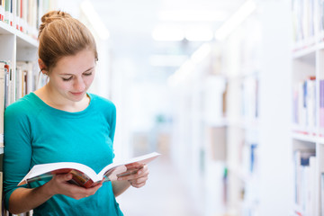 female college student in a library