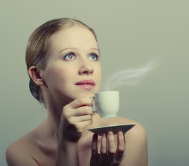 Poster - beauty young woman enjoying a cup of coffee