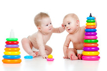 Children Playing With Color Developmental Toys