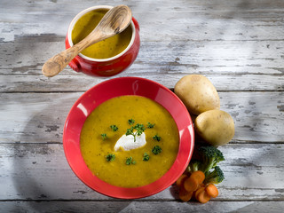 Canvas Print - soup with carrots, broccoli, potato and sheep cheese