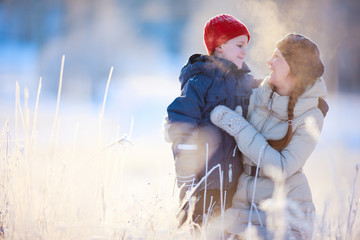 Canvas Print - Mother and son winter portrait