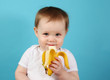 © blessings - Baby eating a banana