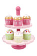 Wooden toy cake stand with cupcakes on white background