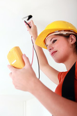 Wall Mural - female electrician working