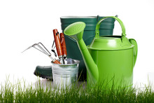 Garden Tools And Watering Can With Grass On White