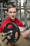 Fototapeta  - men lifting weights