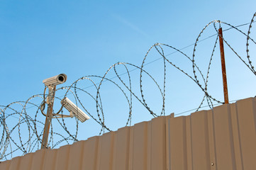 Camera surveillance and barbed wire