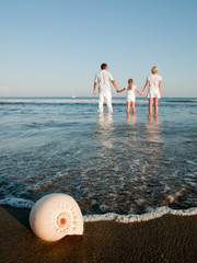 Wall Mural - Summer vacation - family at the beach (copy space)