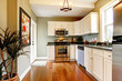 © Iriana Shiyan - Elegant white and green kitchen with cherry floor.