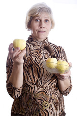 Wall Mural - Senior woman holding fruits