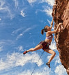 © Greg Epperson - Rock climber dangling.