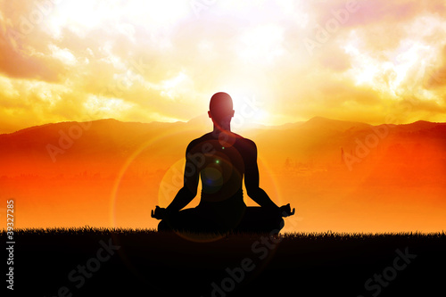 Fototapeta dla dzieci Silhouette of a man figure meditating in the outdoors