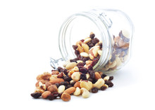 Nuts And Dried Fruits Spilled From A Jar