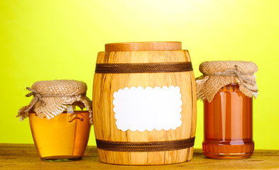 Sweet honey in jars and barrel