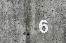 Number Six On Vintage Concrete Wall Background