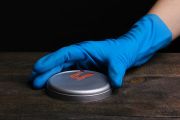 Sticker - Uranium on wooden table isolated on black