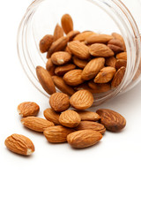 Wall Mural - Almonds in the plastic jar on white