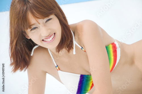 笑顔で寝そべる水着姿の女性 Buy This Stock Photo And Explore Similar Images At Adobe Stock Adobe Stock