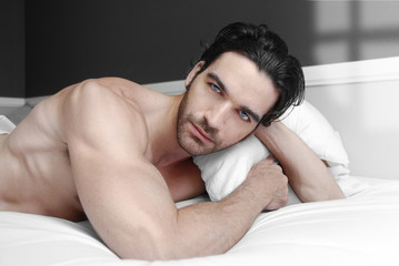 Canvas Print - Male model in bed