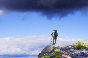 Canvas Print - Man on top of mountain. Conceptual design.