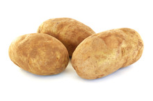 Three Raw Russet Potatoes