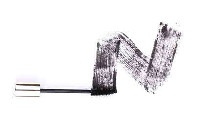 Wall Mural - Black mascara brush stroke isolated on white