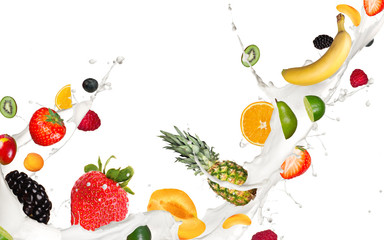 Wall Mural - Fruits pieces falling in milk splash,isolated on white